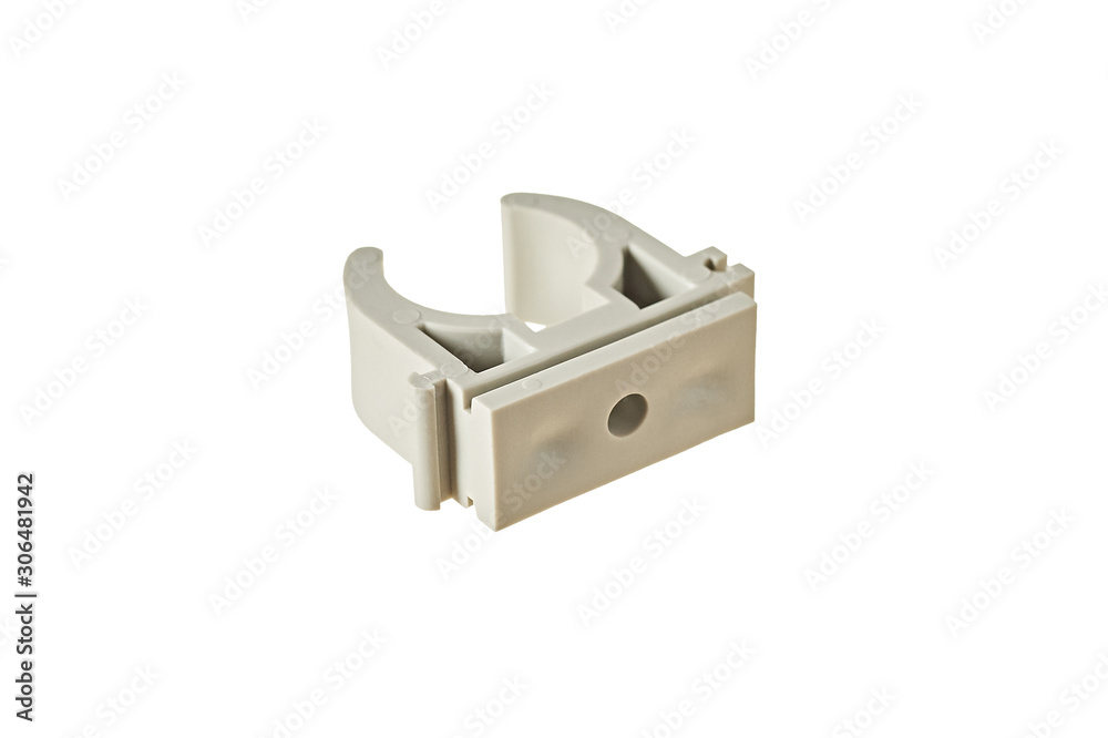 Single modern plastic fastener for polypropylene pipe isolated on white background without shadow. Close-up Single modern plastic fastener for polypropylene pipe isolated on white background without shadow. Close-up