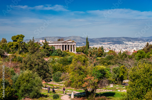 The Temple of Hephaestus (or Theseum), a Doric peripteral temple, located at the north-west side of the Ancient Agora. The city of Athens is in the background. photo