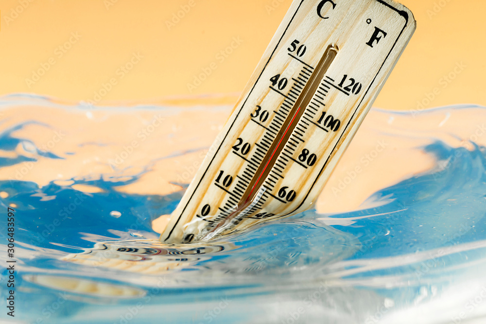 Climate Change Concept Thermometer Immersed In Water Stock Photo