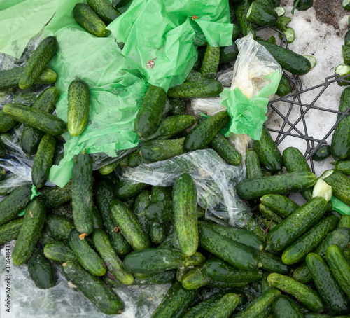 Piles of cucumbers on the landfill photo