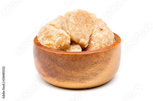 Coconut sugar, Jaggery in a wooden bowl on a white background with clipping path.