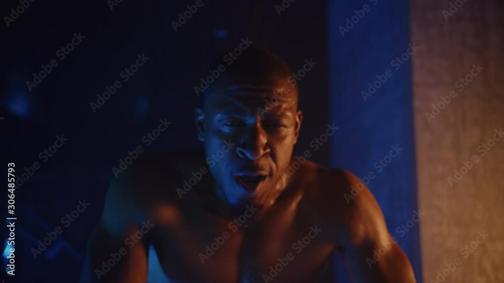 Tired heavy weight pro boxer, resting after intense work out, training in gym, dramatic lightning, shot on Red Weapon Helium Tired heavy weight pro boxer, resting after intense work out, training in gym, dramatic lightning, shot on Red Weapon Helium