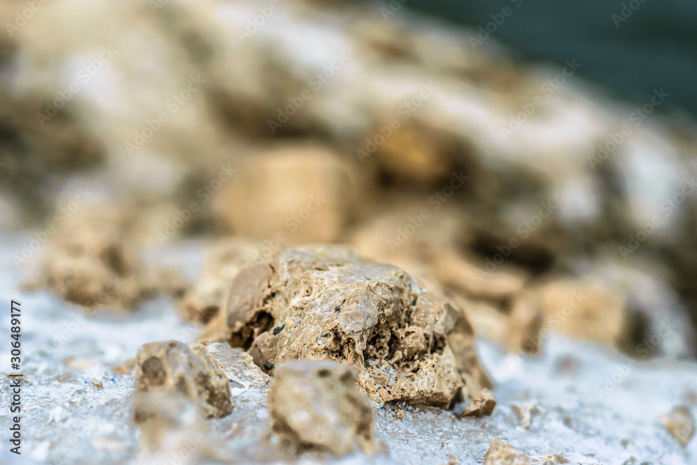 closeup of a marble rocks and white crystal rocks with blurry background closeup of a marble rocks and white crystal rocks with blurry background