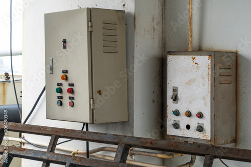 Motor control panel. Control box and distribution. panel switchgear for compressor control. Old electrical panel board with full of rust. Old box for electrical work.