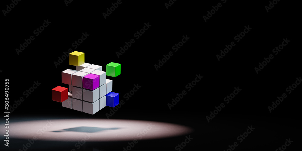 Obraz premium Combining Multicolor Cubes Spotlighted on Black Background