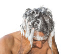 a young man is taking shower with shampoo and washing his head and white background 