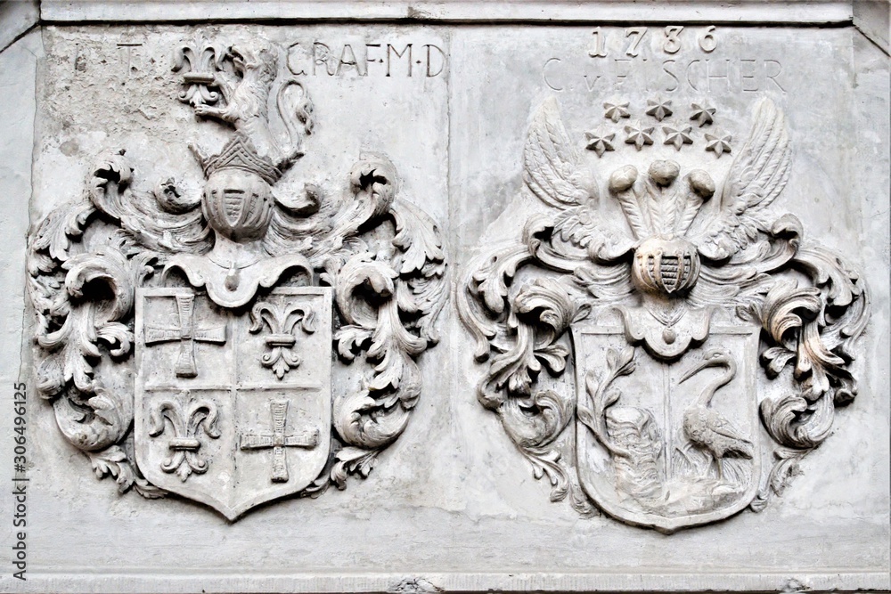 Riga, Latvia, November 2019. Ancient knight`s coats of arms on the wall of St. Peter`s Basilica.