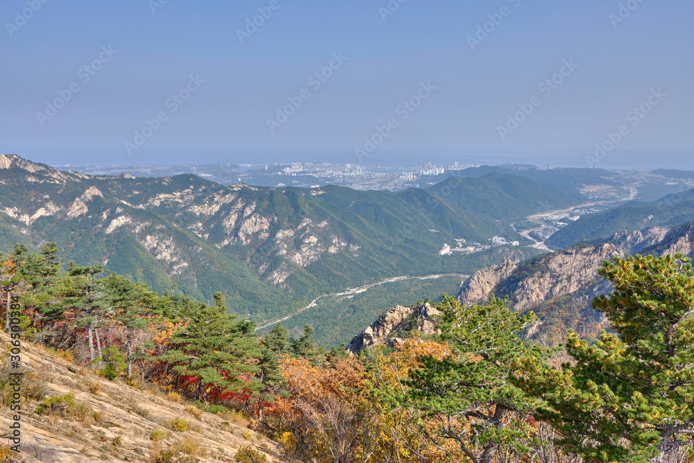 Scenic view of mountains of Dinosaur Ridge in Seoraksan national park near Sokcho in South Korea. Beautiful summer sunny look of green rocks in nature reserve on the north of Republic of Korea.