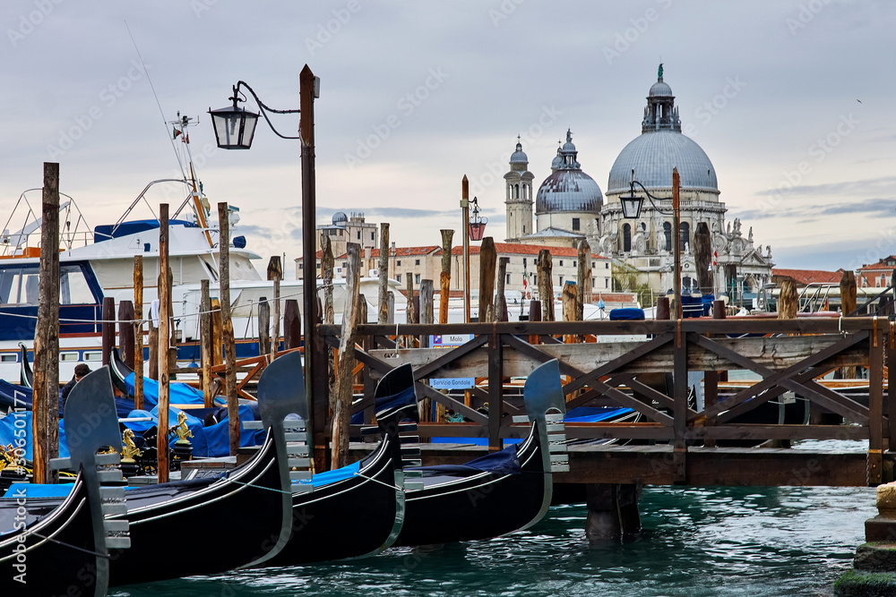 gondolas anchored at pier of San Marco square