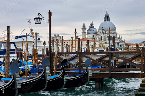 gondolas anchored at pier of San Marco square © Sergey Samoletov