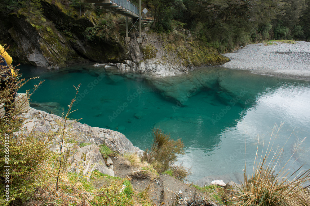 Makaroa Blue Pool located in Mount Aspiring National park in South Island, New Zealand.Crystal clear mountain river. Makaroa Blue Pool located in Mount Aspiring National park in South Island, New Zealand.Crystal clear mountain river.