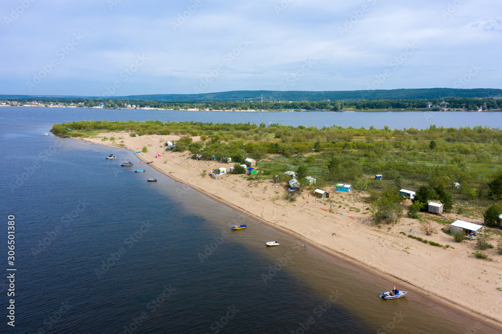 an island on the Volga near Samara. the island is a tent city of tourists and fishermen. People relax in the summer in nature