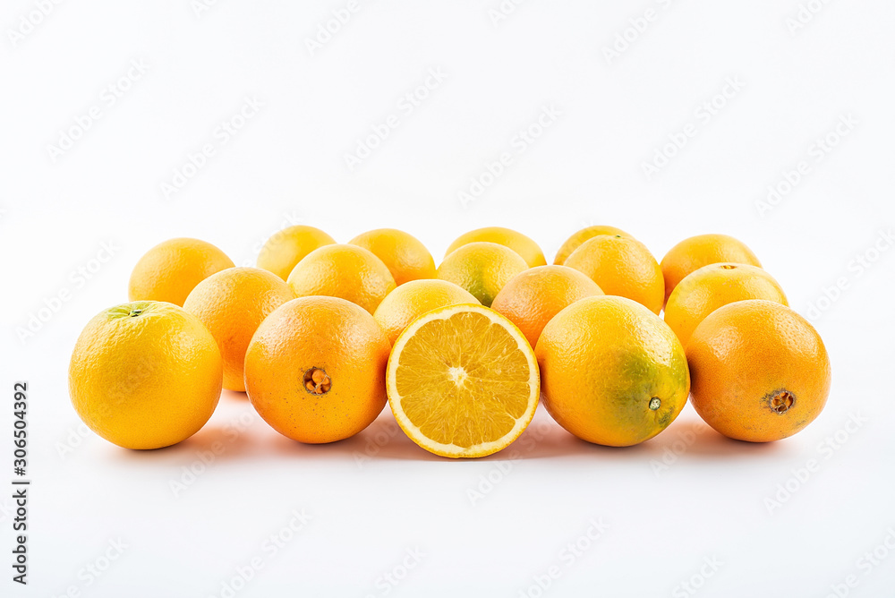 Fresh Nangan Navel Orange and pulp slices on white background Fresh Nangan Navel Orange and pulp slices on white background