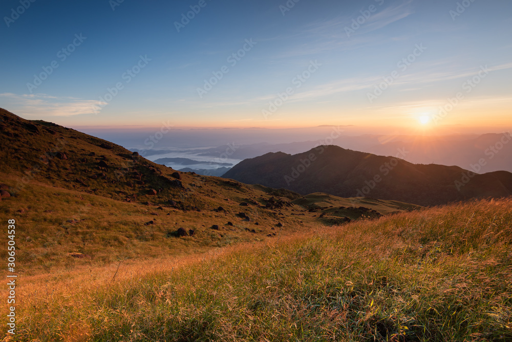 Rising sun with colorful skyline over the mountains in early morning, Natural summer landscape, Mulayit Taung, Moei Wadi, Myanmar