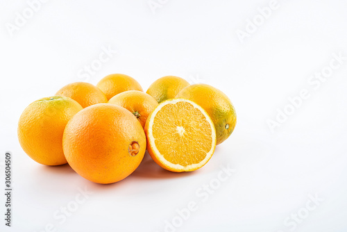 Fresh Nangan Navel Orange and pulp slices on white background