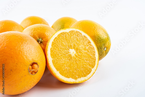 Fresh Nangan Navel Orange and pulp slices on white background