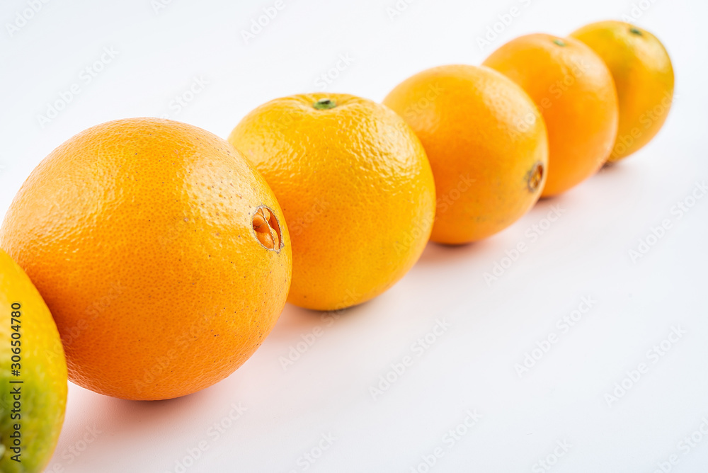 Row of fresh Gannan navel oranges on white background Row of fresh Gannan navel oranges on white background