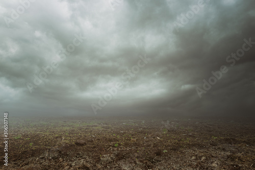 Dark mood background with gravel grass mist and clouds 