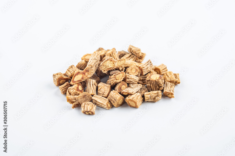 A pile of Chinese herbal medicine windbreak on white background