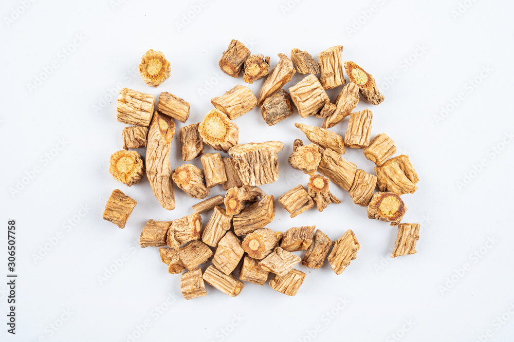 A pile of Chinese herbal medicine windbreak on white background
