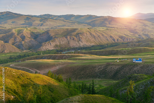 Landscape of alpine meadow with sunrise scenery