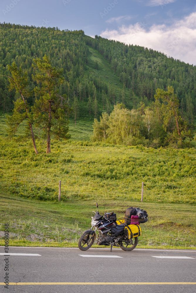 Motorcycle with baggage parking on traveling road Motorcycle with baggage parking on traveling road