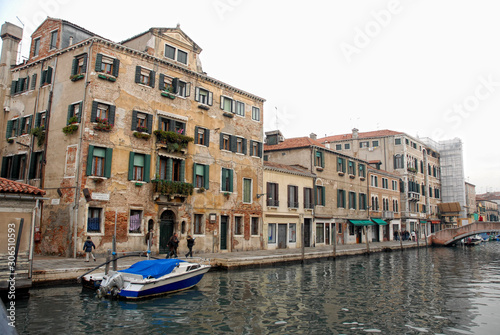  image of a venice canal with old buildings in the background © Oscar
