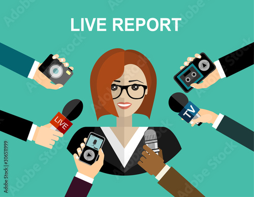 Business woman giving an interview in the presence of journalists with microphones.