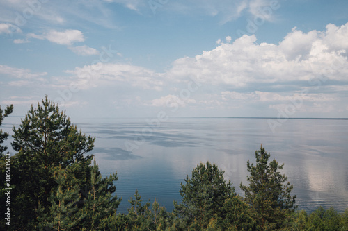 forest landscape with lake and clouds