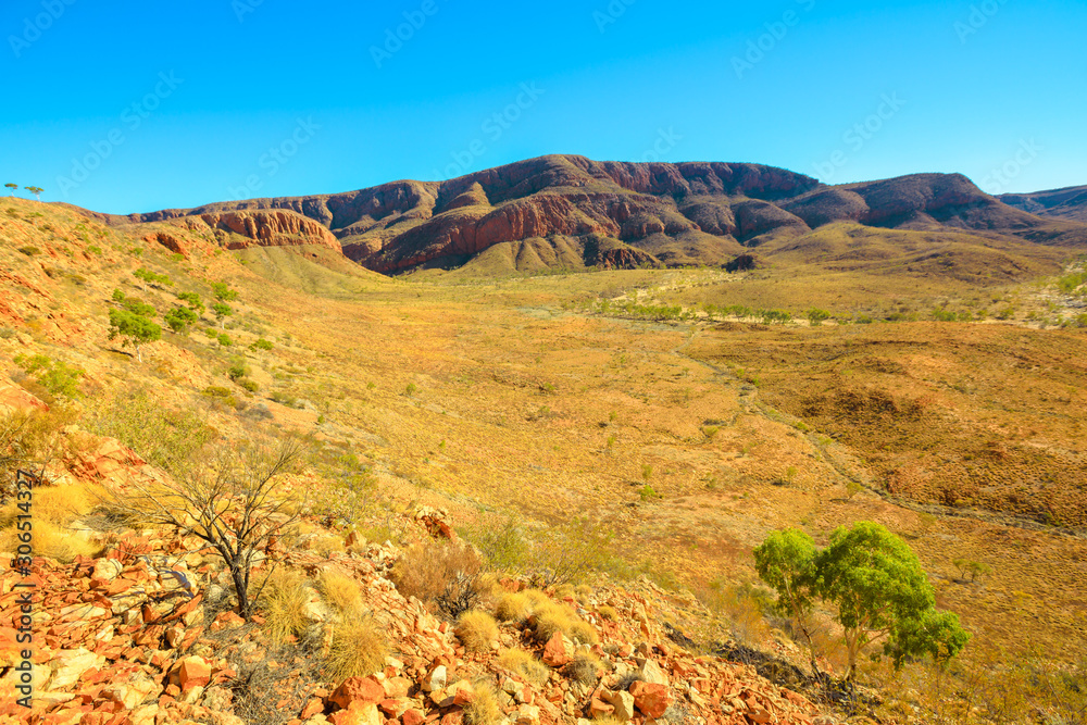 The vastness of Ormiston Gorge at lookout during the Ormiston Pound Walk in West MacDonnell Ranges. In the distance, Mount Sonder, one of highest mountains in Northern Territory, Australia Outback. The vastness of Ormiston Gorge at lookout during the Ormiston Pound Walk in West MacDonnell Ranges. In the distance, Mount Sonder, one of highest mountains in Northern Territory, Australia Outback.