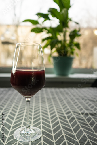 a glass of red wine in the home interior