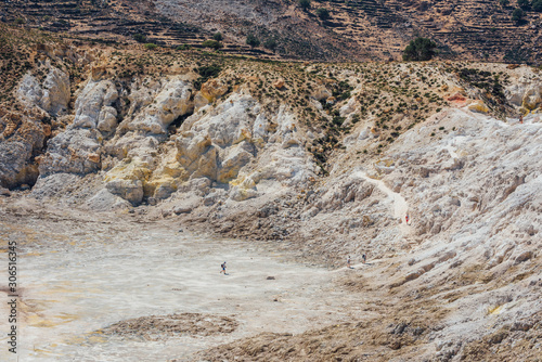 Rocky track to Nisyros volcano crater with tourists