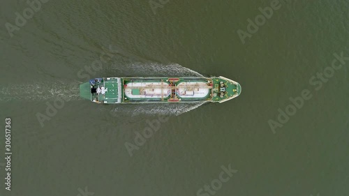 Aerial top view Oil or LPG ship tanker delivery oil from refinery on the sea.