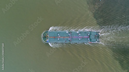 Aerial top view Oil ship tanker delivery oil from refinery on the sea.