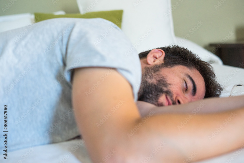 Young man sleeping in bed Young man sleeping in bed