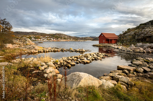 Spangereid, Norway, October 2019: Boat house by the fjord photo