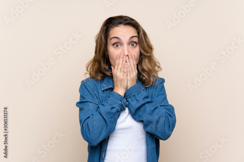 Young blonde woman over isolated background with surprise facial expression