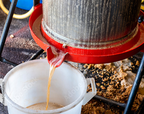 Photos making apple juice with an apple press