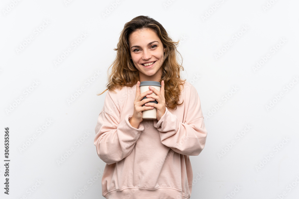 Young blonde woman holding coffee to take away Young blonde woman holding coffee to take away