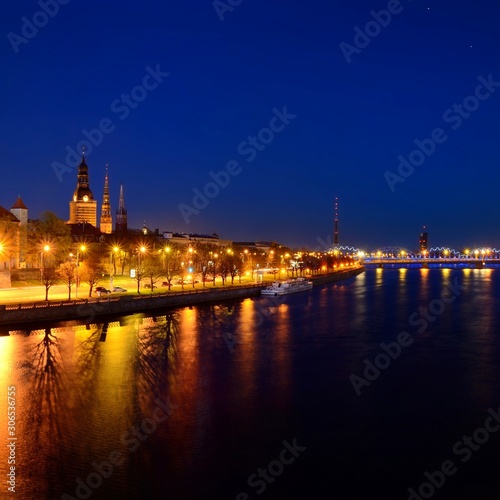general view on Riga embankment and its illumination during nightfall, Latvia