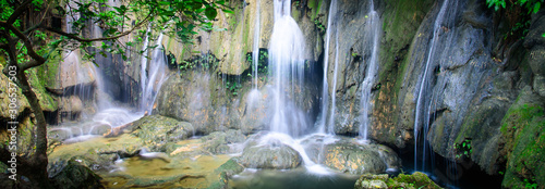 Panoramic mature trees and milky falls at Thac Voi waterfall  Thanh Hoa  Vietnam