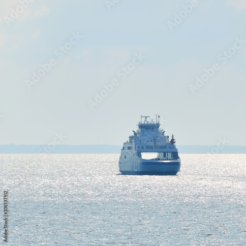 Fototapeta Doubleside ferry sailing in the bright sunny day