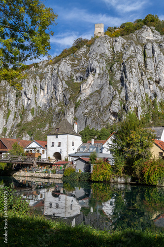 Idyllic view at the village Markt Essing in Bavaria, Germany with the Altmuehl river and high rocks