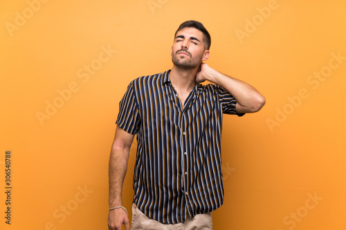 Handsome man with beard over isolated background with neckache