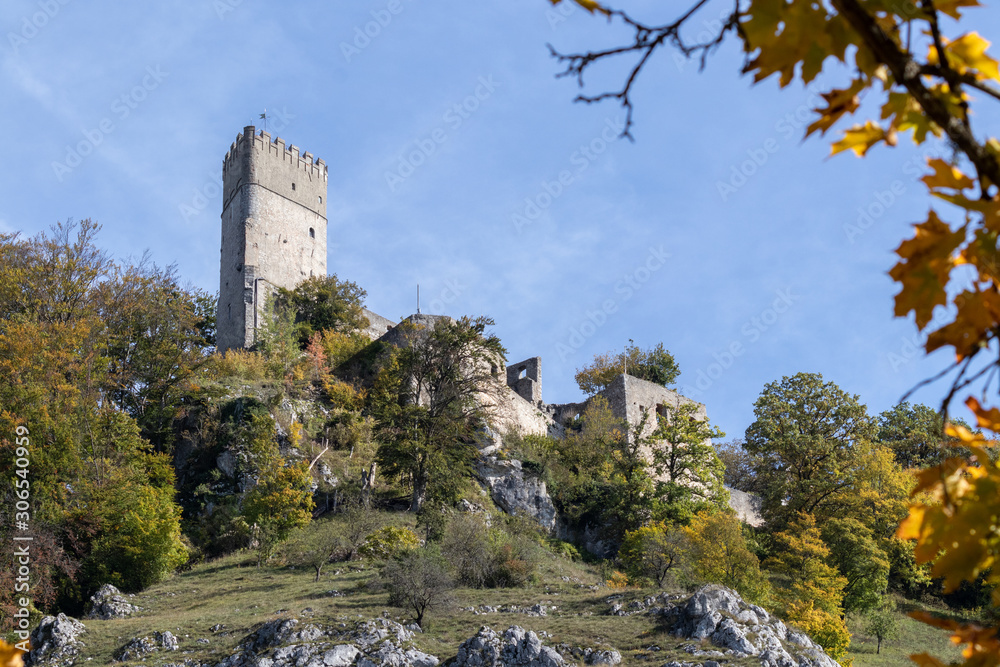 The ruin of Randeck castle in Markt Essing, Bavaria, Germany in autumn with multi colored trees
