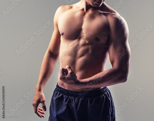 The handsome man show fit and frm body,strong muscle,vintage and art tone photo