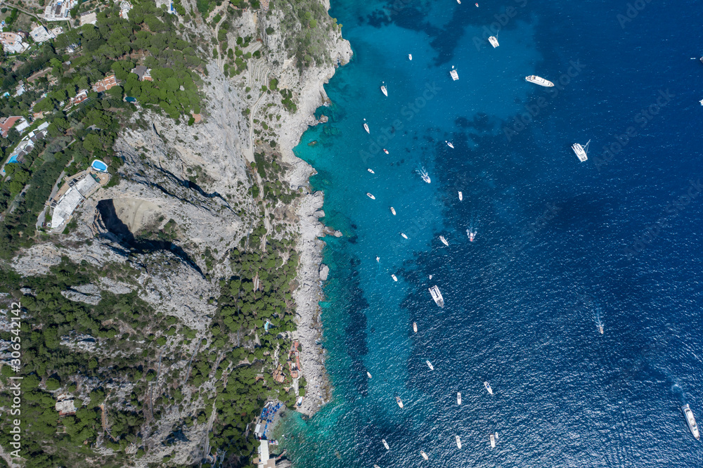 Aerial overhead drone shot of southern Capri Island coastline with mountain  top pool and big hole underneath foto de Stock | Adobe Stock