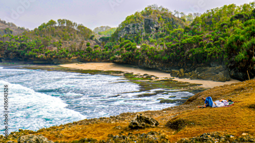 A beautiful beach with white sand and pleasant waves