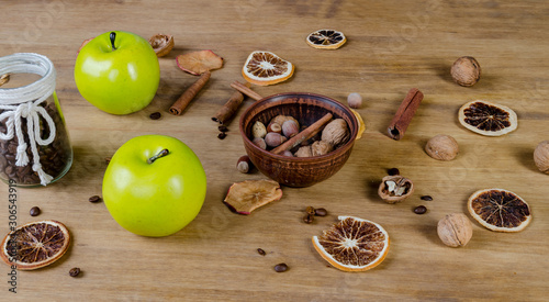 Cinnamon sticks, green apple, nuts, coffee grains and dried fruits