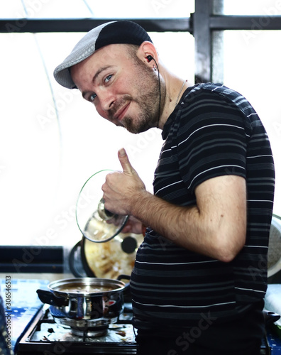 A friend dressed as a Gopnik (Russian street thug) making a soup. photo